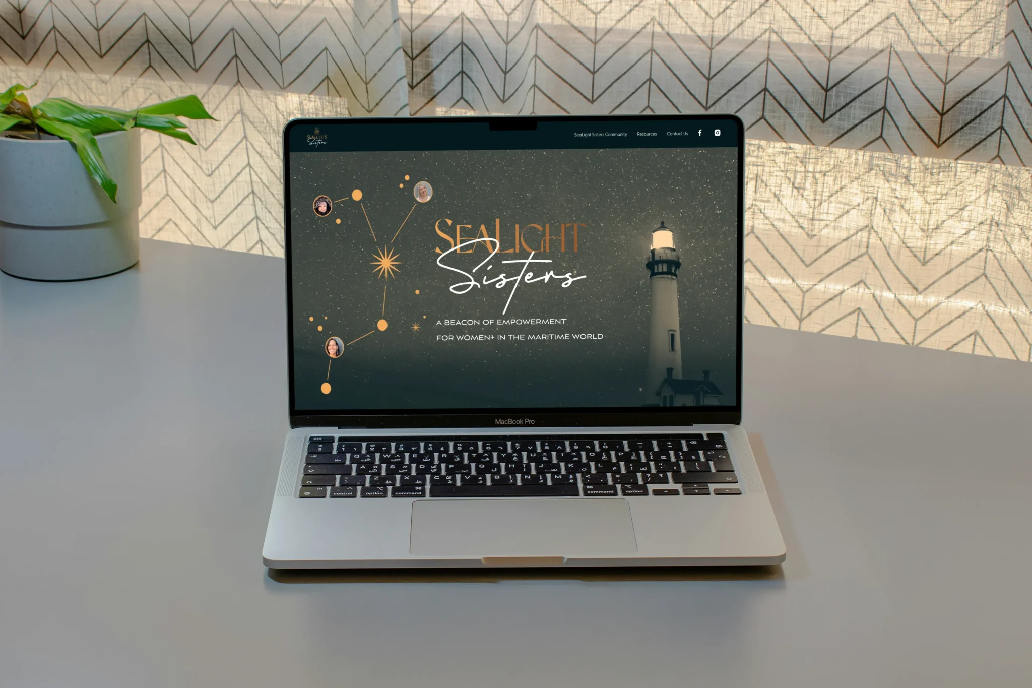 SeaLight Sisters website displayed on a laptop